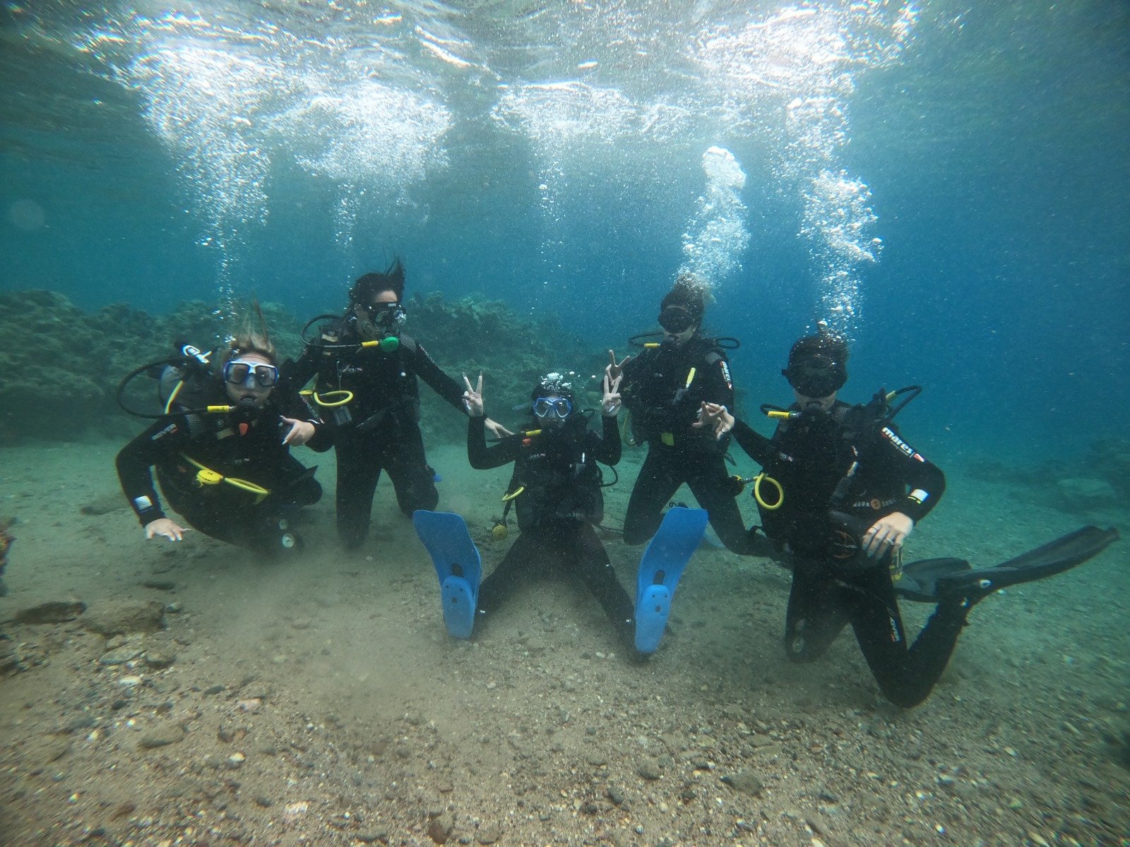 Women scuba diving under water