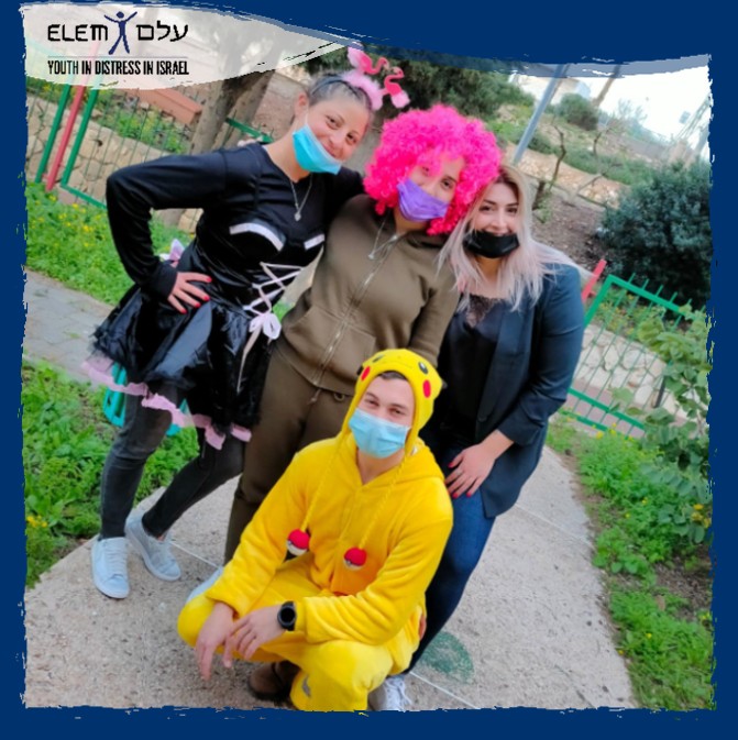 ELEM youth in Purim costumes celebrating women bravery